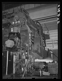 Operating one of the big rollers in production of sheet steel. Pittsburgh, Pennsylvania. Sourced from the Library of Congress.