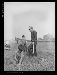 [Untitled photo, possibly related to: Boy picking cranberries. Burlington County, New Jersey]. Sourced from the Library of Congress.