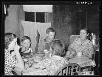 [Untitled photo, possibly related to: WPA (Works Progress Administration) worker and family at dinner. Zeigler, Illinois]. Sourced from the Library of Congress.