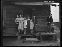 [Untitled photo, possibly related to: Miner's children on porch of their home. Zeigler, Illinois]. Sourced from the Library of Congress.