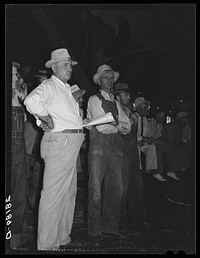 Farmers at livestock auction. Central Iowa Fair, Marshalltown, Iowa. Sourced from the Library of Congress.