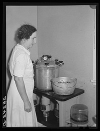 Wife of FSA (Farm Security Administration) resettlement borrower preserving vegetables in her home at San Luis Valley Farms, Colorado. Sourced from the Library of Congress.