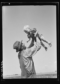 [Untitled photo, possibly related to: Mr. Calvin Brown and grandson, Eaton, Colorado. FSA (Farm Security Administration) borrower]. Sourced from the Library of Congress.