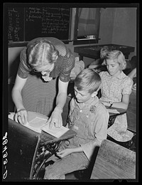 Lois Slinker and one of her pupils in one-room schoolhouse. Grundy County, Iowa. Sourced from the Library of Congress.