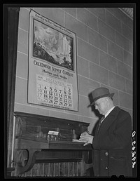 Mule dealer in bank. Creedmoor, North Carolina. Sourced from the Library of Congress.