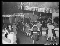 [Untitled photo, possibly related to: Dance hall, Saturday night. Marshalltown, Iowa]. Sourced from the Library of Congress.
