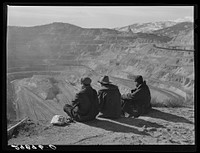 Workers sitting at edge of copper pit. Ruth, Nevada. Sourced from the Library of Congress.