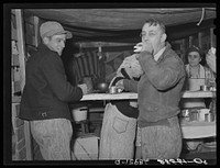 Farmer at lunch stand. Cornhusking contest. Marshall County, Iowa. Sourced from the Library of Congress.