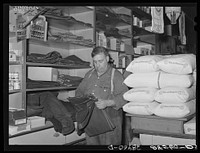 Farm clothes and flour. General store. Lamoille, Iowa. Sourced from the Library of Congress.