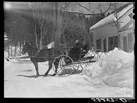 Mr. G.W. Clarke, seventy one years old farmer who has always lived in Vermont, brings butter to town to sell on Saturdays. Woodstock, Vermont. Sourced from the Library of Congress.