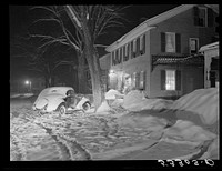 Old home converted into an inn at night. Woodstock, Vermont. Sourced from the Library of Congress.