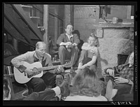 Skiers from Boston, Massachusetts, relaxing in lodge at North Conway, New Hampshire. Sourced from the Library of Congress.