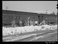 Skiers arriving early in the morning with the weekend "ski-meister." North Conway, New Hampshire, center of the Eastern Slopes ski territory. Sourced from the Library of Congress.
