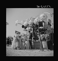 Children enjoying the midway after a parade at the Memphis cotton carnival. Memphis, Tennessee. Sourced from the Library of Congress.