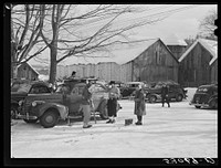 [Untitled photo, possibly related to: Every available space for parking is used by skiers on weekends at Clinton Gilbert's farm. The house is about eight years old; purchased by Gilbert in 1929. He has about 150 acres, mainly a dairy farm with twenty three cows. He also makes about one hundred gallons of maple syrup every year. First skiing town in U.S. built on this farm in 1934 by White Cupboard Inn, but Gilbert now owns and runs tow and it has increased his income about 25 percent. Has enabled him to build small ski lodge and do many repairs to property]. Sourced from the Library of Congress.