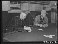 Farmers playing cards in pool room in town on a winter morning in Woodstock, Vermont. Sourced from the Library of Congress.