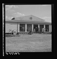[Untitled photo, possibly related to: The assembly building is always open for meetings, games, reading, and recreational activities at Okeechobee migratory labor camp. Belle Glade, Florida]. Sourced from the Library of Congress.