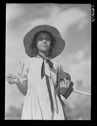 [Untitled photo, possibly related to: Melrose, Natchitoches Parish, Louisiana. Daughter of mulatto family returning home after fishing in the Cane River]. Sourced from the Library of Congress.