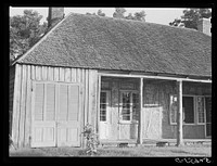 [Untitled photo, possibly related to: Melrose, Natchitoches Parish, Louisiana. Old home with mud walls built by mulattoes, now a part of the John Henry cotton plantation. Sourced from the Library of Congress.