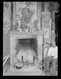 Melrose, Natchitoches Parish, Louisiana. Fireplace in old mud hut built and still lived in by French mulattoes near John Henry cotton plantation.  Belongs to Rocque family (see general caption). Sourced from the Library of Congress.