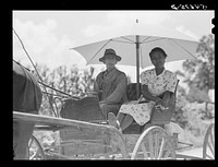 Melrose, Natchitoches Parish, Louisiana. Mulatto and his daughter going to town for groceries and supplies in cotton plantation area. Sourced from the Library of Congress.