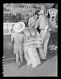 One of project family buying groceries and supplies in their co-op store. Transylvania Project, Louisiana. Sourced from the Library of Congress.