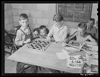 The assembly building is always open for games, reading, recreation and meetings at Osceola migratory camp. Belle Glade, Florida. Sourced from the Library of Congress.