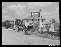 Grocery store, bar, gasoline station and tourist cabin along highway near Bardstown, Kentucky. Sourced from the Library of Congress.