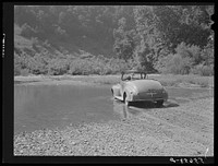 Car fording creek up Morris Fork of the Kentucky River. Kentucky. Sourced from the Library of Congress.