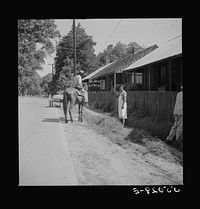 [Untitled photo, possibly related to: Street scene on Saturday afternoon in Natchez, Mississippi]. Sourced from the Library of Congress.