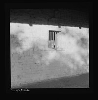 Melrose, Natchitoches Parish, Louisiana. "African" house, probably storeroom, smokehouse, or jail when built by mulattoes, now part of John Henry cotton plantation, originally the Yucca Plantation (from Spanish). See general caption. Sourced from the Library of Congress.