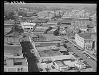 [Untitled photo, possibly related to: Five points, center of city, with Chesterfield cigarette factories in background. Durham, North Carolina]. Sourced from the Library of Congress.