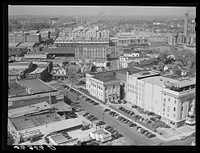 [Untitled photo, possibly related to: Center of city, with Chesterfield cigarette factory in background. Durham, North Carolina]. Sourced from the Library of Congress.