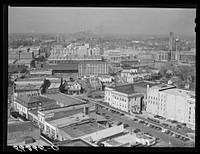 Center of city, with Chesterfield cigarette factory in background. Durham, North Carolina. Sourced from the Library of Congress.