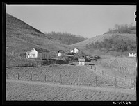 Noah Garland's son's home along the creek. Southern Appalachian Project, near Barbourville, Knox County, Kentucky. Sourced from the Library of Congress.