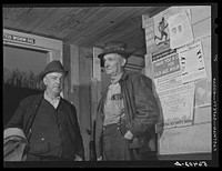 John Patterson and S.H. Castle inside Mr. Castle's store and post office. Southern Appalachian Project, Knox County, near Barbourville, Kentucky. Sourced from the Library of Congress.