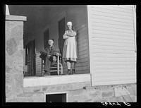 [Untitled photo, possibly related to: Josh Calahan and wife on the porch of their new home. Southern Appalachian Project near Barbourville, Knox County, Kentucky]. Sourced from the Library of Congress.