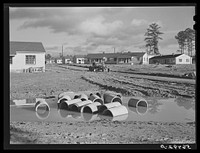 [Untitled photo, possibly related to: Defense housing project, Newton D. Baker Village, under authority of housing commission of Columbus, Georgia. Construction delayed on account on account of heavy rains]. Sourced from the Library of Congress.