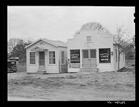 The new meat market and Portman cafe. Forest Hill, by Camp Claiborne, near Alexandria, Louisiana. Sourced from the Library of Congress.