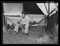 [Untitled photo, possibly related to: D.C. Lovelady in front of tent. He drives a truck at Camp Livingston construction job and is from Monroe, Louisiana]. Sourced from the Library of Congress.