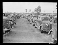[Untitled photo, possibly related to: Parked cars off side of highway near entrance to Camp Claiborne all belonging to construction workers, this roadside congestion extends for over a mile. Louisiana]. Sourced from the Library of Congress.