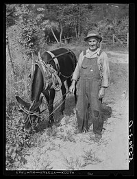 Mountaineer with his mule which is not only the best animal for hard work on hillsides but also better for travel over rought, rocky roads and creek beds. Up Berton's Fork, off Middle Fork of Kentucky River. Breathitt County, Kentucky. Sourced from the Library of Congress.
