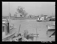 Trappers' and fishermen's boats and homes along the bayou. Delacroix Island, Louisiana. Sourced from the Library of Congress.