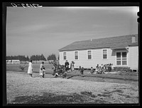 [Untitled photo, possibly related to: Children of migratory laborers outside of day nursery at Okeechobee migratory labor camp. Belle Glade, Florida]. Sourced from the Library of Congress.
