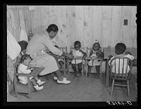 Hot lunches for children of agricultural workers in day nursery of Okeechobee migratory labor camp. Belle Glade, Florida. Sourced from the Library of Congress.
