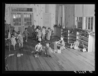 Agricultural and packing house workers' children playing in the twenty-four hour a day nursery at Osceola migratory labor camp. Belle Glade, Florida. Sourced from the Library of Congress.