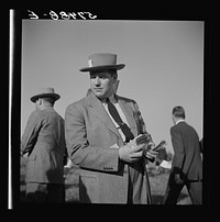 [Untitled photo, possibly related to: Bookies taking bets at horse races. Warrenton, Virginia]. Sourced from the Library of Congress.
