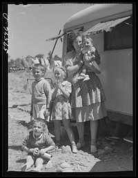 Mrs. Frank Robbins and her children, who live in trailer near United Aircraft where her husband works nights. East Hartford, Connecticut (see number 57571D). Sourced from the Library of Congress.