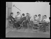 Workers from electric boat company plant in recreation room of new dormitory for workers in defense industries. Groton, Connecticut. Constructed and managed by FSA (Farm Security Administration). Sourced from the Library of Congress.
