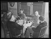 Finnish construction workers from New York, drinking beer and spending their leisure time in a new cafe near Camp Blanding. They were unable to work because of the heavy rains. Starke, Florida. Sourced from the Library of Congress.
